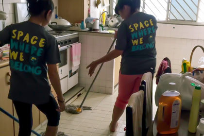 girls helping to clean elderly home